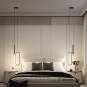 Luminária decorativa moderna pendente em ambiente de quarto com cama