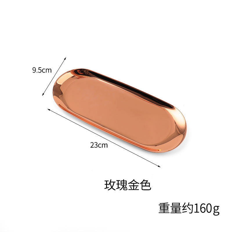 Bandeja dourada oval com design minimalista nórdico